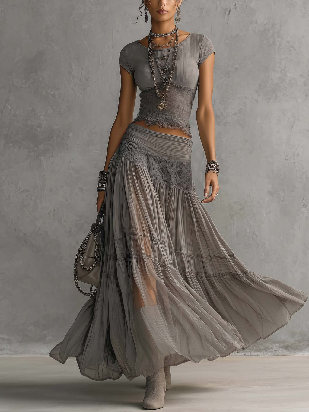 Conjunto Elena com top de painéis de renda e saia maxi plissada