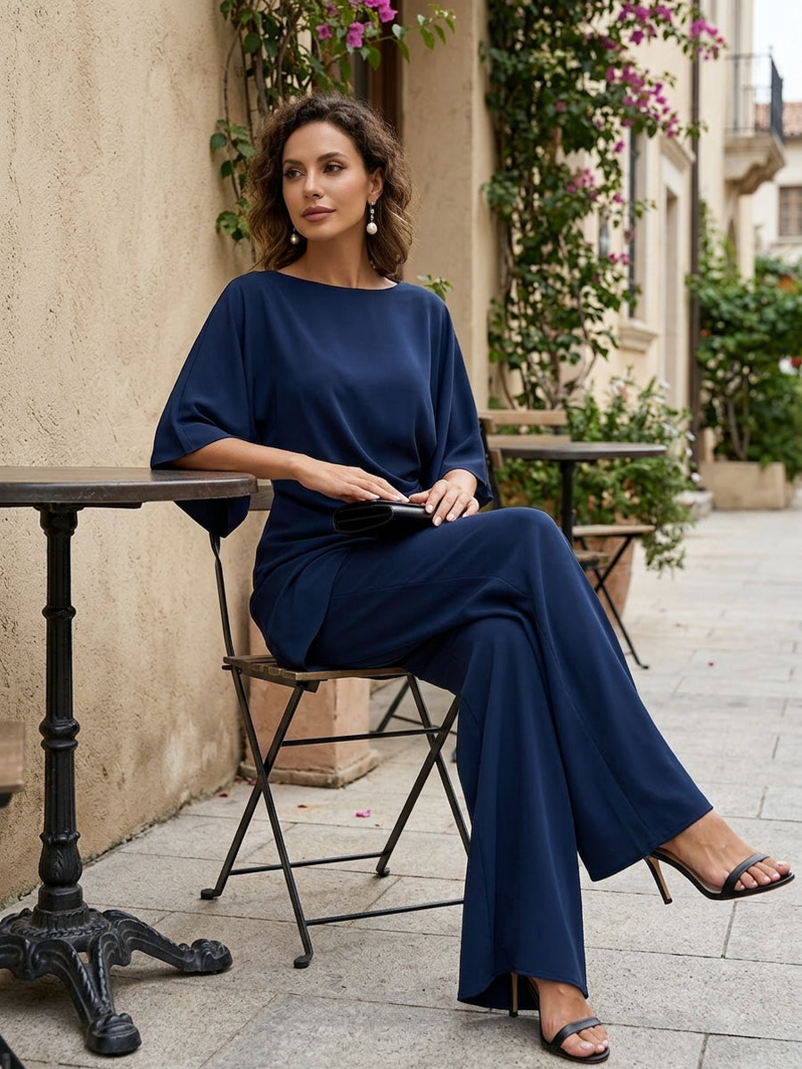 Genevieve Bennett and Lowe two-piece pants set with cape-sleeve draped waist, featuring stylish, modern design and tailored fit.