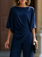 Lucretia Bennett and Lowe draped asymmetrical wide-leg two-piece set, showing the flowing fabric and stylish design.