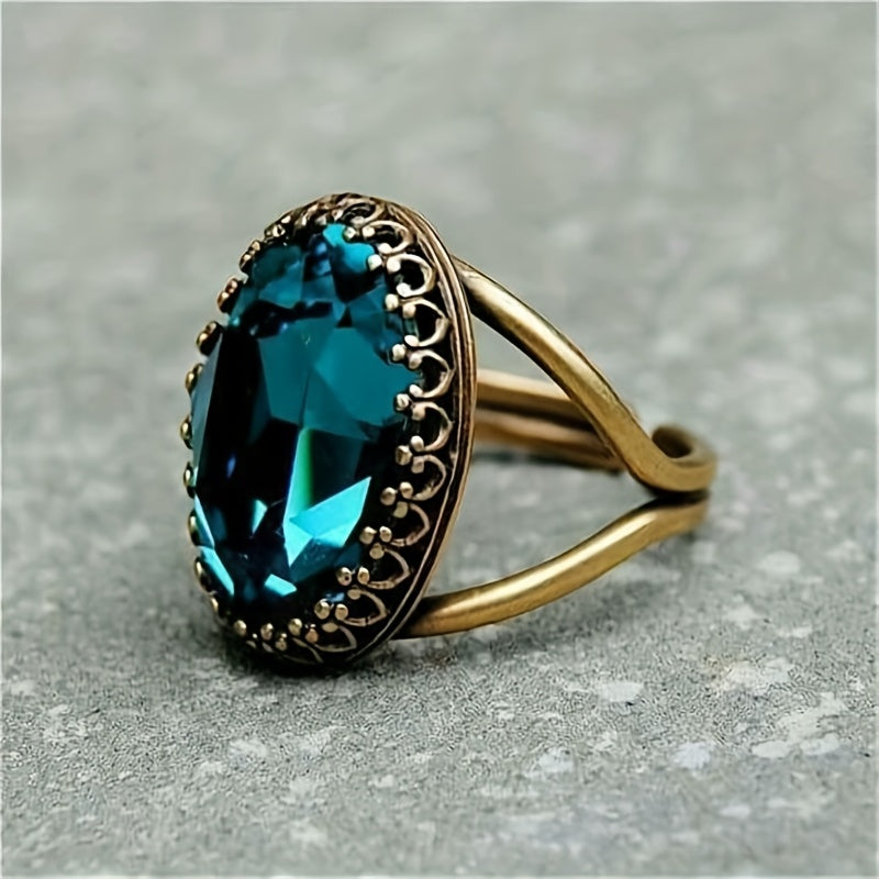 Anel elegante banhado a ouro com pedra azul oval