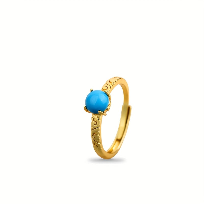 Elegante anillo dorado de banda con piedra de turquesa lisa