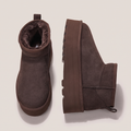 Pair of brown platform ankle boots showing the plush lining and side profile