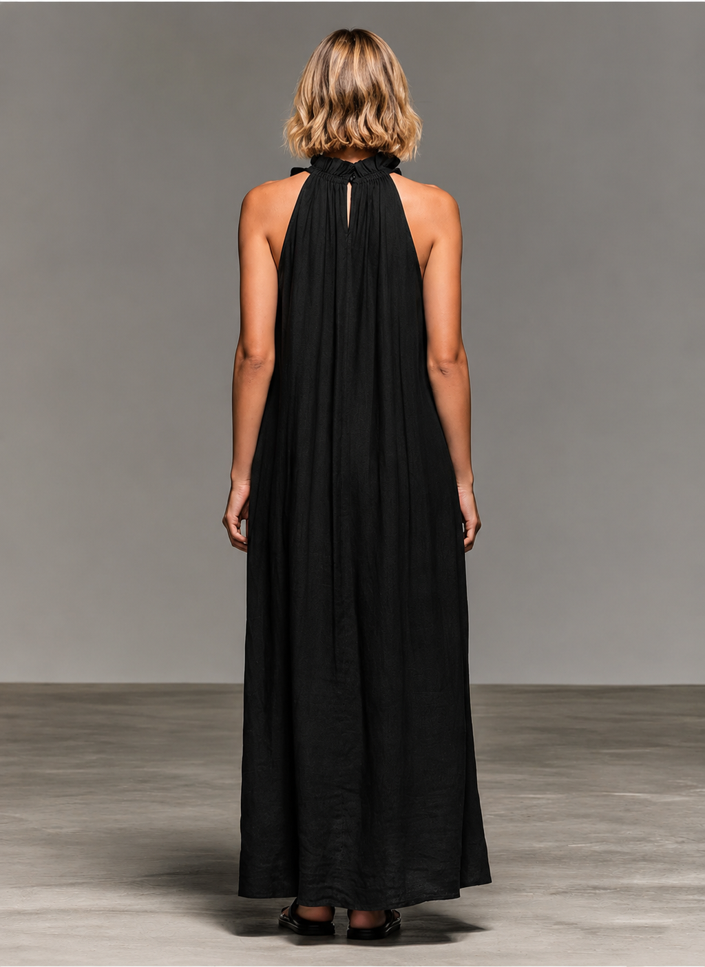Emma soft ruffle maxi dress by Bennett and Lowe, flowing fabric with ruffle details, full-length dress on a hanger.
