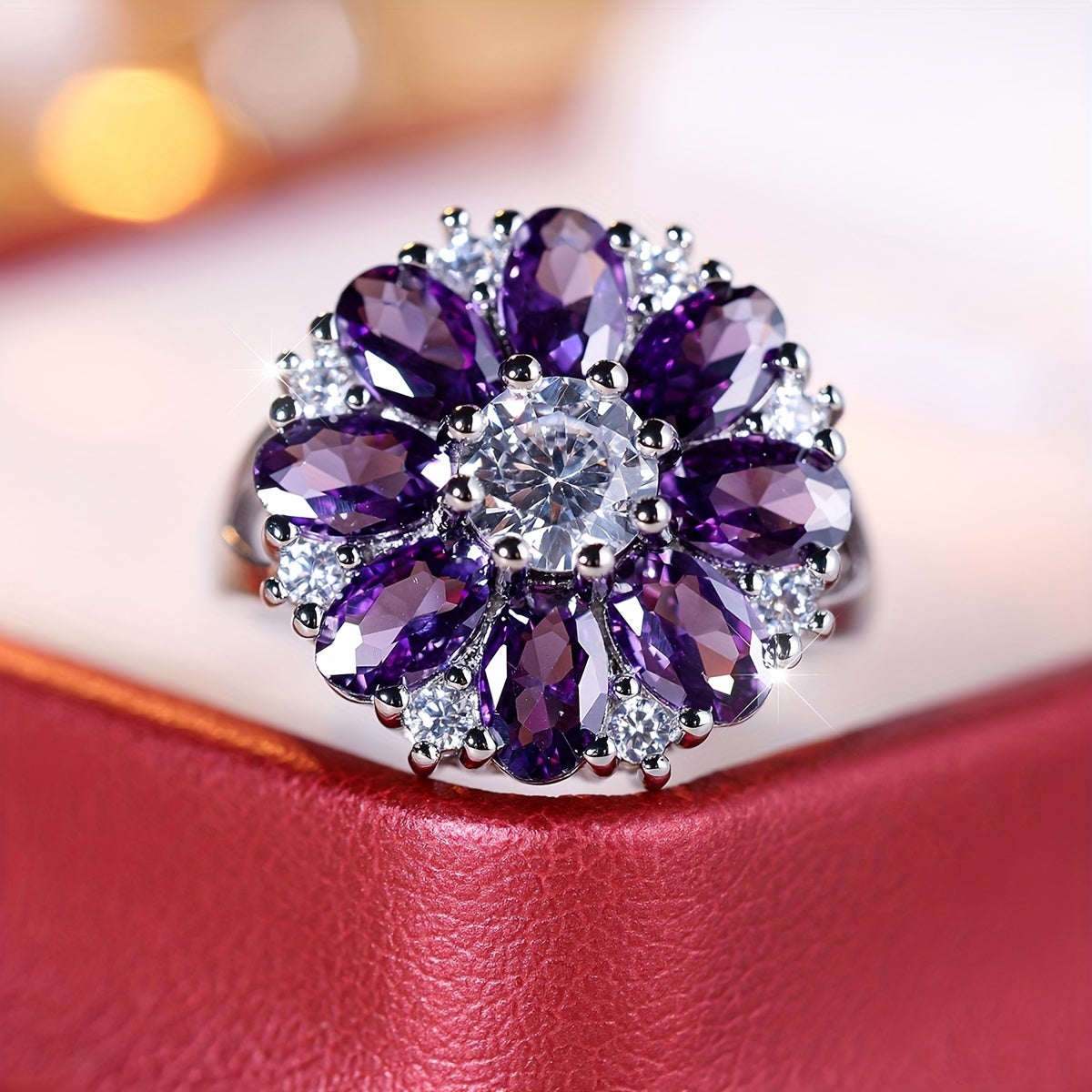 Anel elegante e vistoso com flor de zircónias roxas
