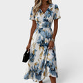 Elara | Vestido midi floral cruzado en la cintura
