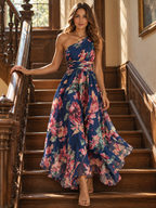 Elegant portrait of the Celeste one-shoulder floral maxi dress by Bennett and Lowe, featuring a flowing gown on an elegant staircase.