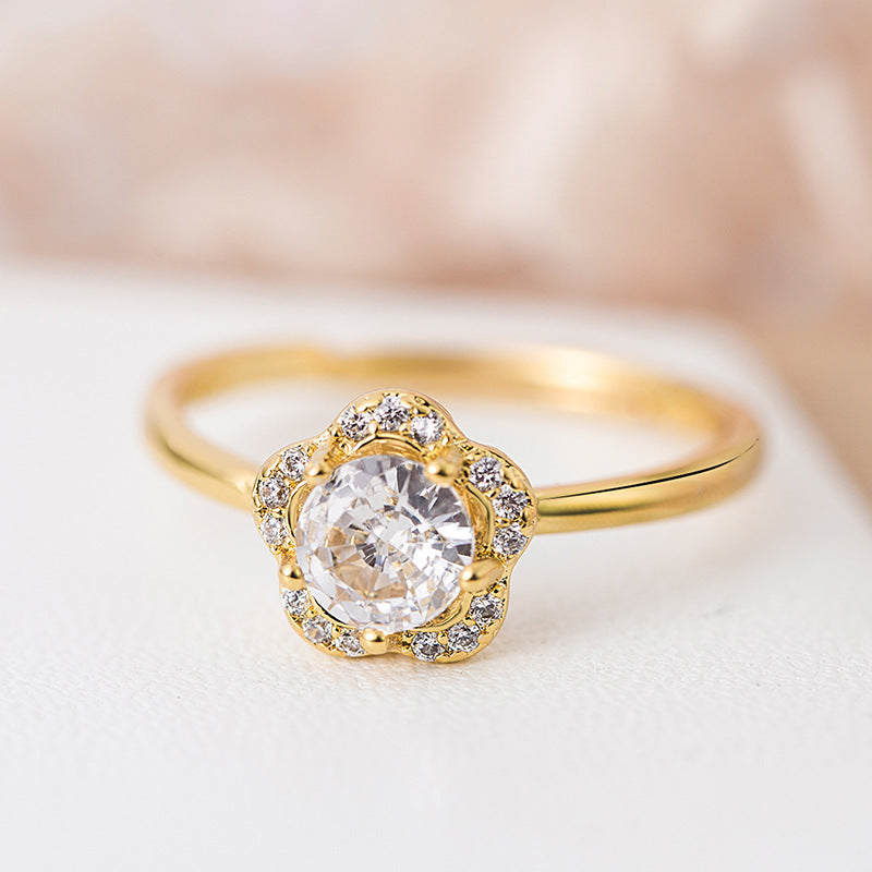 Anillo de oro con zirconia brillante en forma de flor