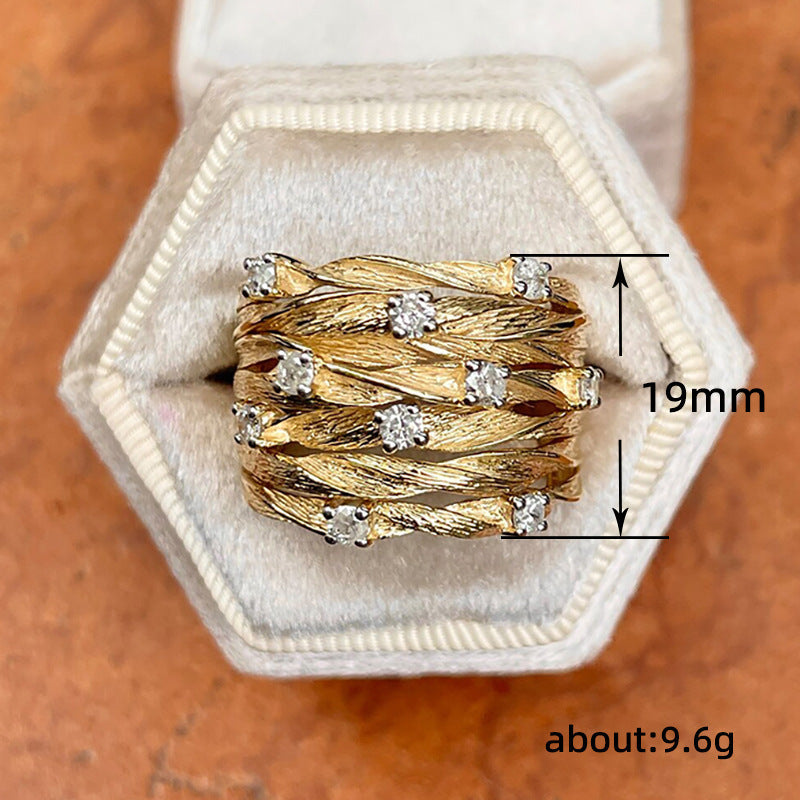 Elegante anillo de banda con circonitas, en forma de estrella dorada y enredadera sinuosa
