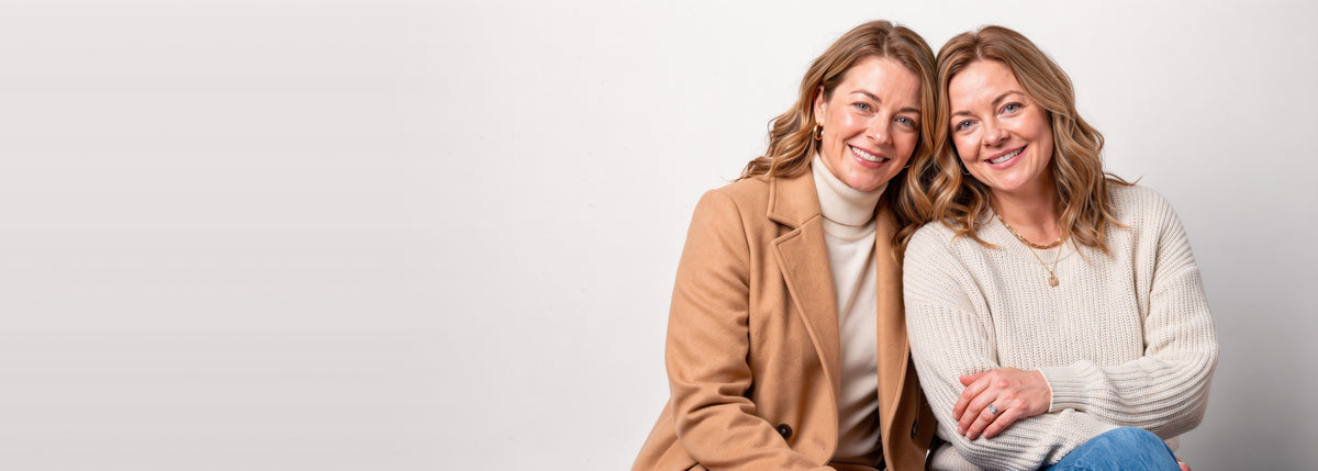Two sisters, Olive and Mae, in fall knitwear and a camel wool coat