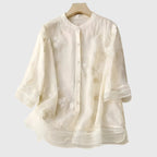 Nellie | Top elegante com flores bordadas