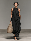 Gladys maxi dress with pockets by Bennett and Lowe, featuring a flowing silhouette and casual style, shown in the image.