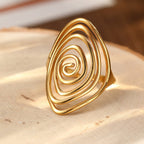 Anillo llamativo dorado, escultórico y en espiral, Vortex