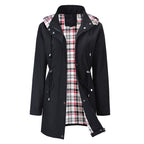 Black Lauren waterproof 3-in-1 women's rain coat with detachable hood by Bennett and Lowe, shown on a model.