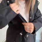 Black waterproof 3-in-1 raincoat for women with detachable hood by Bennett and Lowe, shown on a model.