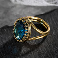 Anel elegante banhado a ouro com pedra azul oval