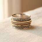 Anel giratório marcante de inspiração vintage, em prata e dourado