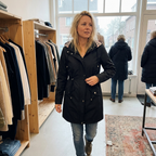 Lauren waterproof 3-in-1 women's rain coat by Bennett and Lowe with detachable hood, shown in a versatile outdoor setting.