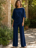Genevieve Bennett and Lowe two-piece pants set with cape-sleeve top and draped waist, stylish and elegant fashion ensemble.