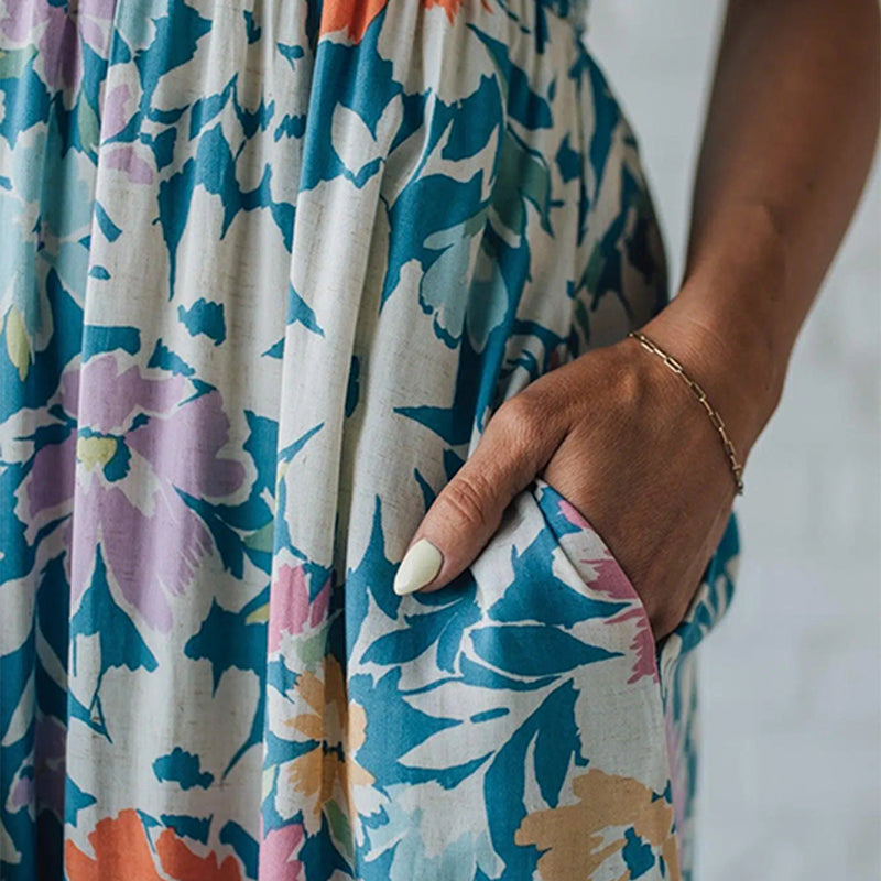 Vestido comprido floral com corpete franzido e alças ajustáveis