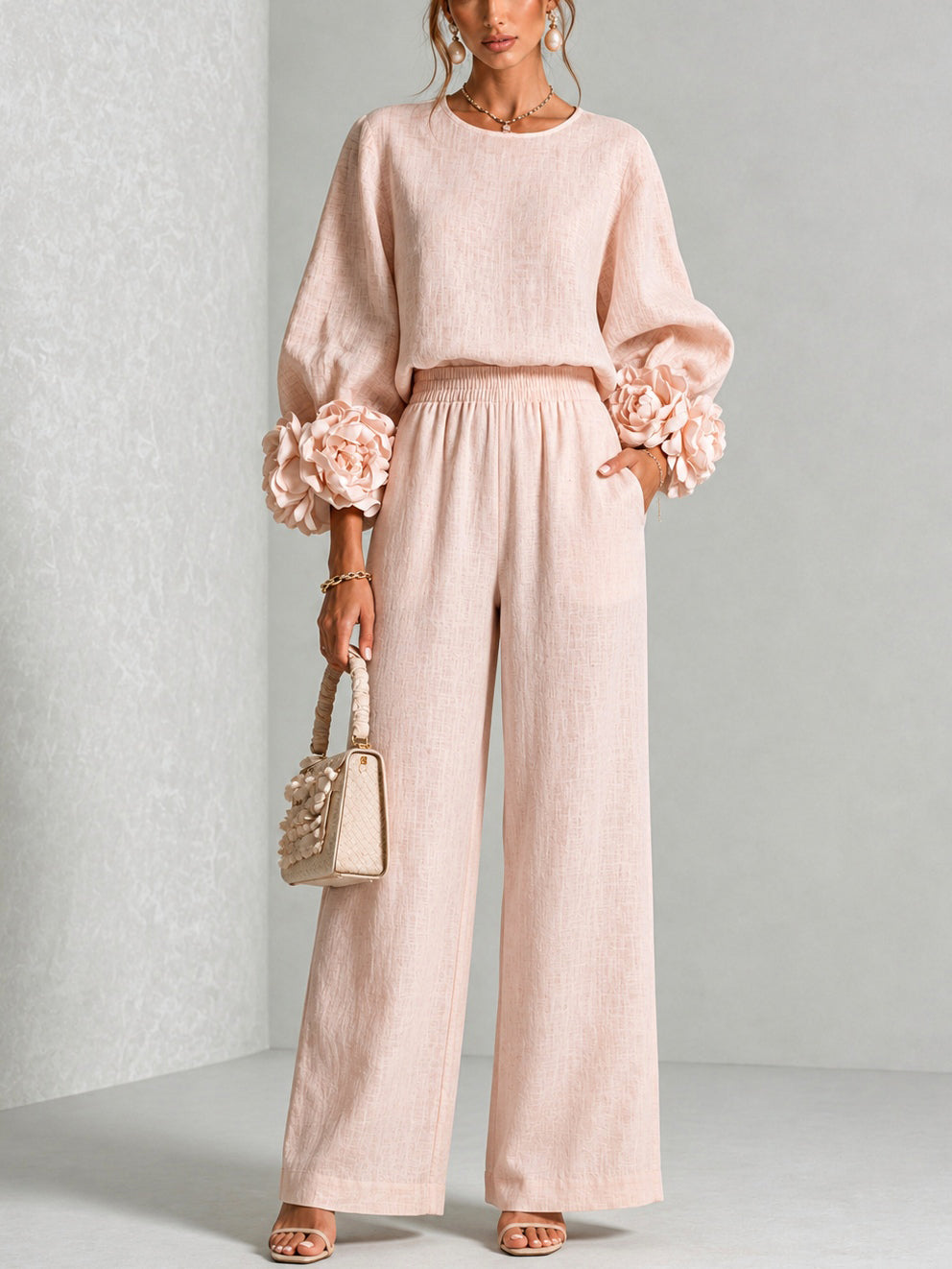 Women's sweater set in pink with ruffle cuff knit top and wide leg pants